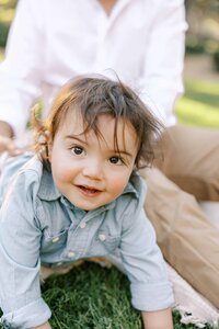 toddler boy smiling at camera