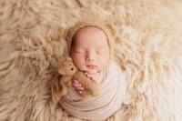 Beautiful newborn portraits in Elk Grove and Sacramento, capturing your baby's precious moments with simple elegance. Book your session today