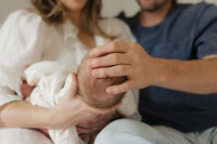 dad-hand-newborn-head-parents-blurred-in-home-lifestyle-boulder-photographer-44
