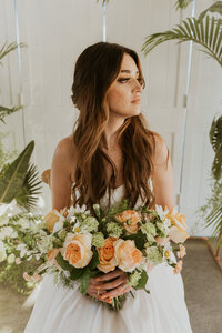 Tropical Summer Bride holding her Bridal Bouquet.