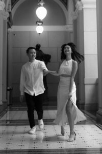 Intimate embrace of a couple at Narodni muzeum - artistic black and white photography by Lucie Muse