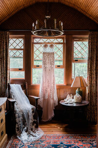 Bridal gown hands near a sunlit window