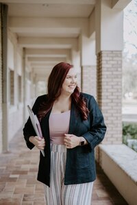 Ashlee-outside-in-hallway-smiling