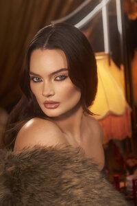 Caitlin Lawson wearing elegant makeup for the Charlotte Tilbury campaign, with vibrant tones, shot by Ylva Erevall.