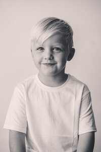 Little boy smiles at the camera during Personality Portrait Photoshoot in Charleston, SC.