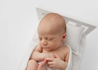 Sleeping baby at a styled newborn photography session by newborn photographer Lauren Vanier