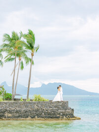 Bride and groom wide angle view, landscape from the intercontinental Tahiti
