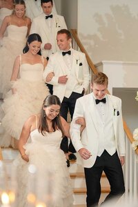 bridal party photos coming down stairs