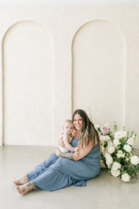 A family is having fun in a park while capturing beautiful memories at an Austin photo studio.