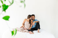 Expecting couple sharing a tender moment during their maternity session in Bend.