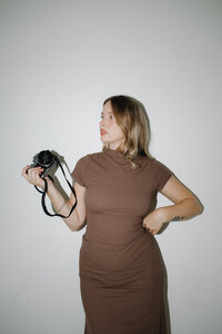 photographer holding film camera
