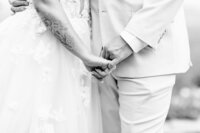 Bride and groom hold hands during emotional ceremony in Tennessee