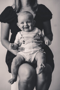 Baby smiles at the camera during Personality Photoshoot in Charleston, South Carolina.
