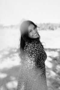 Black-and-white portrait of a singer-songwriter photographed during a multi-concept branding session