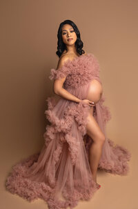 mother-to-be in boho style gown during outdoor maternity photography near Los Angeles