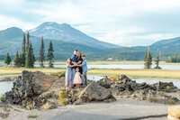 Family holding each other close during family photoshoot in Bend Oregon