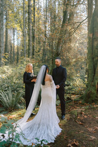 Vancouver elopement photographer captures couple during their ceremony in Stanley Park Vancouver