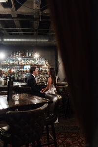 Engagement photos at a bar.Kansas City Wedding Photographer.CaitlynCloudPhotography24