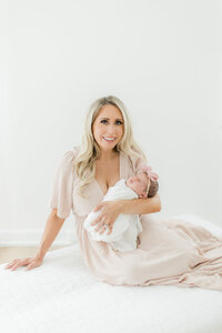 Beautiful mom with her baby girl photographed by South Jersey Newborn Photographer Tara Federico