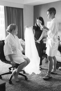 bride with hairdresser before wedding in san francisco hotel