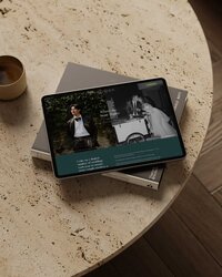 Laptops with the website for Love & Latitudes pulled up.