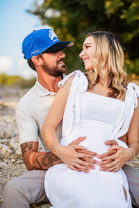 Intimate portrait of a couple during a maternity session by Graceful Ray Photography in Texas.