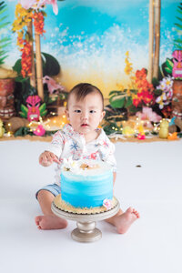 Baby Eating First Birthday Cake