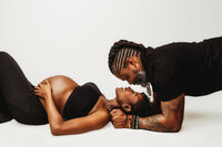 Expectant parents pose for studio Maternity Portraits at Holy City Babies Portrait Studio in Charleston, SC.
