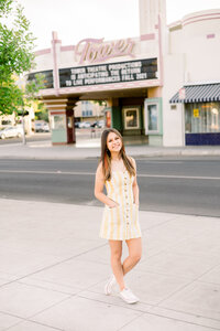 A senior poses for her photos in Downtown Fresno