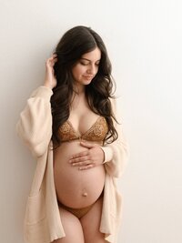 Pregnant mother photographed during a Portland studio boudior maternity session.