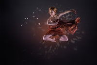 Dancer in a red costume suspended mid-leap against a dark background scattered with points of light.