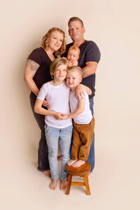 Studio family portrait with parents and newborn baby boy in New Bern NC