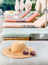 hat-on-top-of-lounge-chair