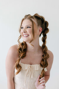 A romantic half-up braided style perfect for brunches, birthdays, or bridal showers at SoCo Blow Dry Bar