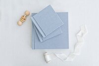 blue newborn album with matching grandparent albums by Ivanna Vidal Photography