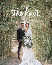 Kohnur bride with natural radiant makeup, pink lipstick, and loose waves in whimsical bamboo garden wedding editorial featured on The Knot