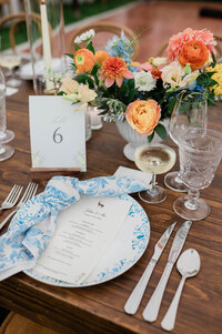 Wedding reception place setting with the dinner menu