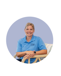 Woman client of Florida Social Butterfly with blond hair sitting in a chair with blue shirt