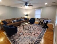 The Loft at Crossed Keys Inn spacious common area with lounge seating for overnight guests. Loft kitchenette and dining table at Crossed Keys Inn for groups booking full inn rental