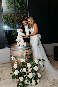 Groom and bride cut their wedding cake