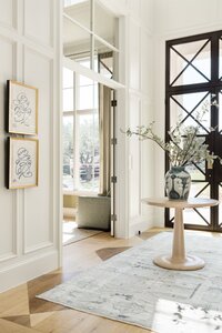daley home sunny bell new construction entryway with dark trimmed front door