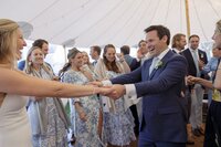 Bride and Groom smile during first dance.