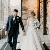 bride and groom outdoor stone building