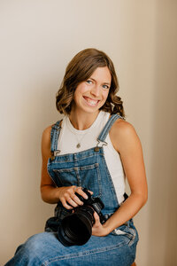A couple leans in for a kiss on their wedding day in front of the white chapel at Grace City Church in Wenatchee, Washington.