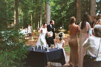 Couple walking into their wedding reception in Saranac Lake, NY at Camp Canaras captured on film