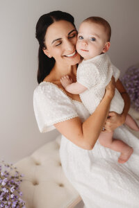 Charleston Motherhood Photographer - Mother poses with her baby during studio Mother's Day Mini Sessions at Holy City Babies Portrait Studio in Charleston, SC.