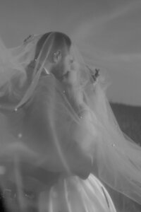 A beautiful and intimate moment of a married couple kissing and hugging each other, capturing their love and connection