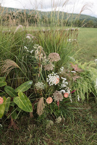 Textural florals and grasses by Flowergirl Cville for a wedding at Henley's Orchard. Navodita KC Photography.