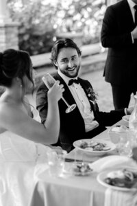 Wedding reception with groom laughing, taken by best Detroit, MI wedding photographer