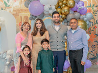 Los Angeles baby shower photography family portrait at the celebration, captured in true to life color with clean natural light and candid documentary style.